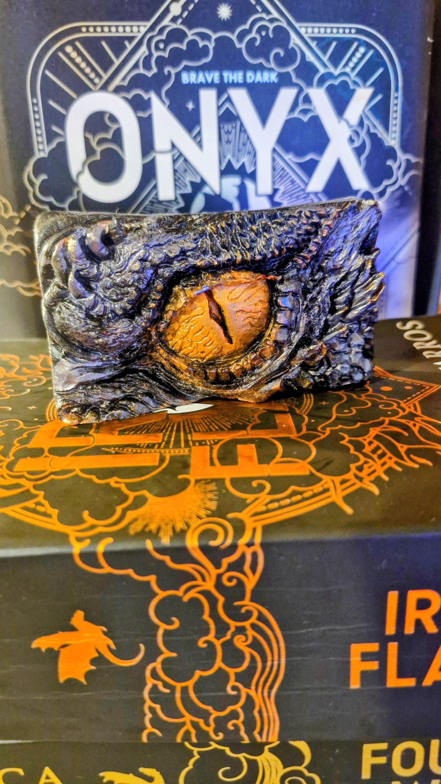 Dragon eye figurine on a box with 'Onyx Storm' branding Empyrean Series Books Violet Sorrengail, Tairn Dragon 